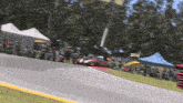 a red race car is going around a curve on a race track