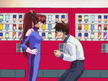 a man is kneeling down next to a woman in a blue suit
