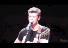 a man singing into a microphone with the website www.bandicam.com at the bottom
