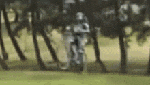 a blurry picture of a person riding a bike