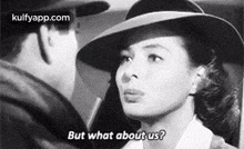 a man and a woman are looking at each other in a black and white photo . the woman is wearing a hat .