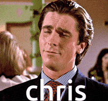 a man in a suit and tie with the name chris written on the bottom