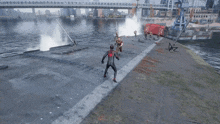 a man in a spiderman costume is laying on the ground