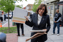 a woman in a suit is holding a piece of paper that says ' washington dc ' on it