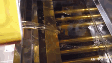 water is being poured into a metal container with the words made by animatica visible