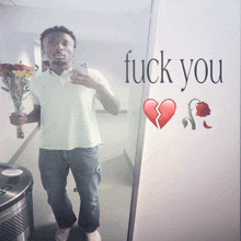 a man taking a selfie with a broken heart and the words fuck you