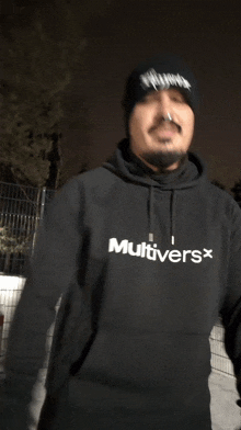 a man wearing a hoodie that says multiversx on it