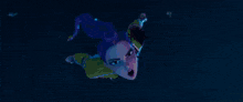 a person is flying through the air with a purple light coming out of their mouth .