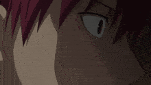 a close up of a person 's face with red hair and a white eye