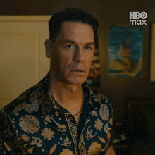 a man in a floral shirt is looking at the camera with hbo max written on the bottom