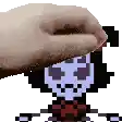a hand is touching a pixel art drawing of a skeleton .
