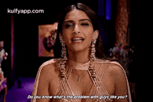 a woman is talking to a man and asking him what 's the problem with guys like you ?