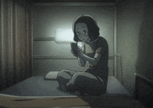a woman is sitting on a bed looking at her cell phone