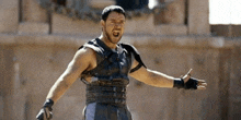 a man with his arms outstretched and a beard