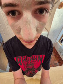 a person wearing a shirt that says ninja festival on it