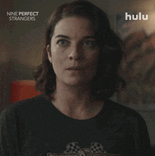 a woman in a nine perfect strangers shirt says " yes "
