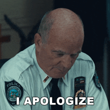 a police officer with a patch that says i apologize on it