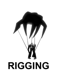 a black and white photo of a man holding a parachute with the word rigging written below him
