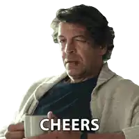 a man in a sweater is holding a cup of coffee with the word cheers written on it