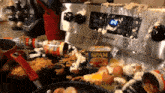 a messy kitchen with a can of spam on the stove