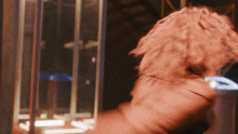 a blurred image of a person 's back with a hoodie on