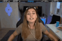 a woman wearing headphones is sitting in front of a screen that says simply funny