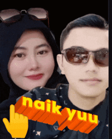 a man and a woman are standing next to each other with the words " naik yuu " on the bottom right