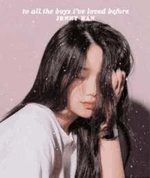 a girl with long black hair is covering her face with her hand and a quote from jenny han .