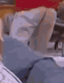 a person is sitting in a chair with a blurred background .