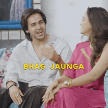 a man and a woman are sitting on a couch with the words bhag jaunga written in yellow