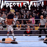 a wrestler in a ring with the word wrestlemania in the background