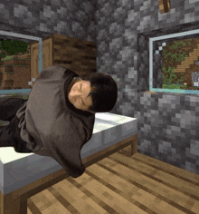 a person is laying on a bed in a minecraft game