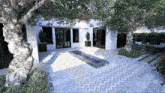 an artist 's impression of a patio with a fountain and trees