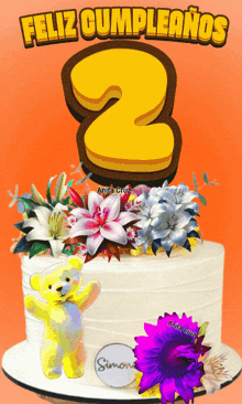 a birthday cake with flowers and a teddy bear and the number 2 on top
