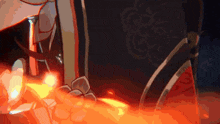 a close up of a person 's feet with a sword in the background .