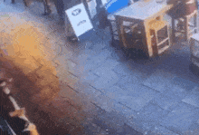 a blurred image of a restaurant with tables and chairs on the floor .