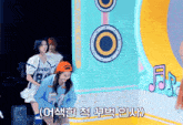 a girl wearing a cowboy shirt is standing next to another girl wearing a number 54 shirt