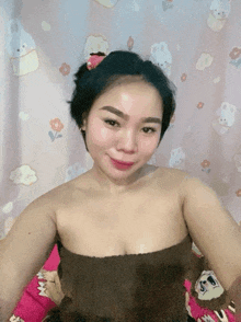 a woman without a shirt is laying on a bed