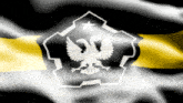 a black and yellow flag with an eagle and a star