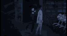a silhouette of two people standing next to each other holding a stick .