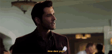 a man in a suit says how dare you in a room