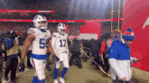 two buffalo bills players walking off the field