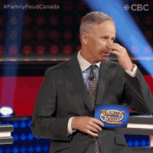 Pinch Nose Gerry Dee GIF - Pinch Nose Gerry Dee Family Feud Canada GIFs