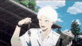 a boy with white hair is holding a key and a book with the word tokyo on it