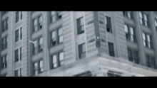 a very tall building with a lot of windows is shown in a blurry photo