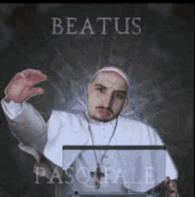 a picture of a man dressed as a pope holding a laptop with the name beatus on the bottom