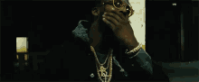 thinking shades on gold chain necklace gangster pardison fontaine gif