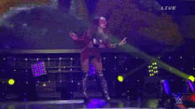 a woman is standing on a stage with a sign that says rivalsha banks