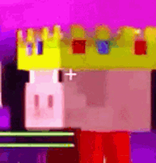 a toy castle with a yellow crown and a red cross on it