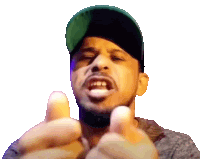 a man wearing a green hat is giving a thumbs up sign